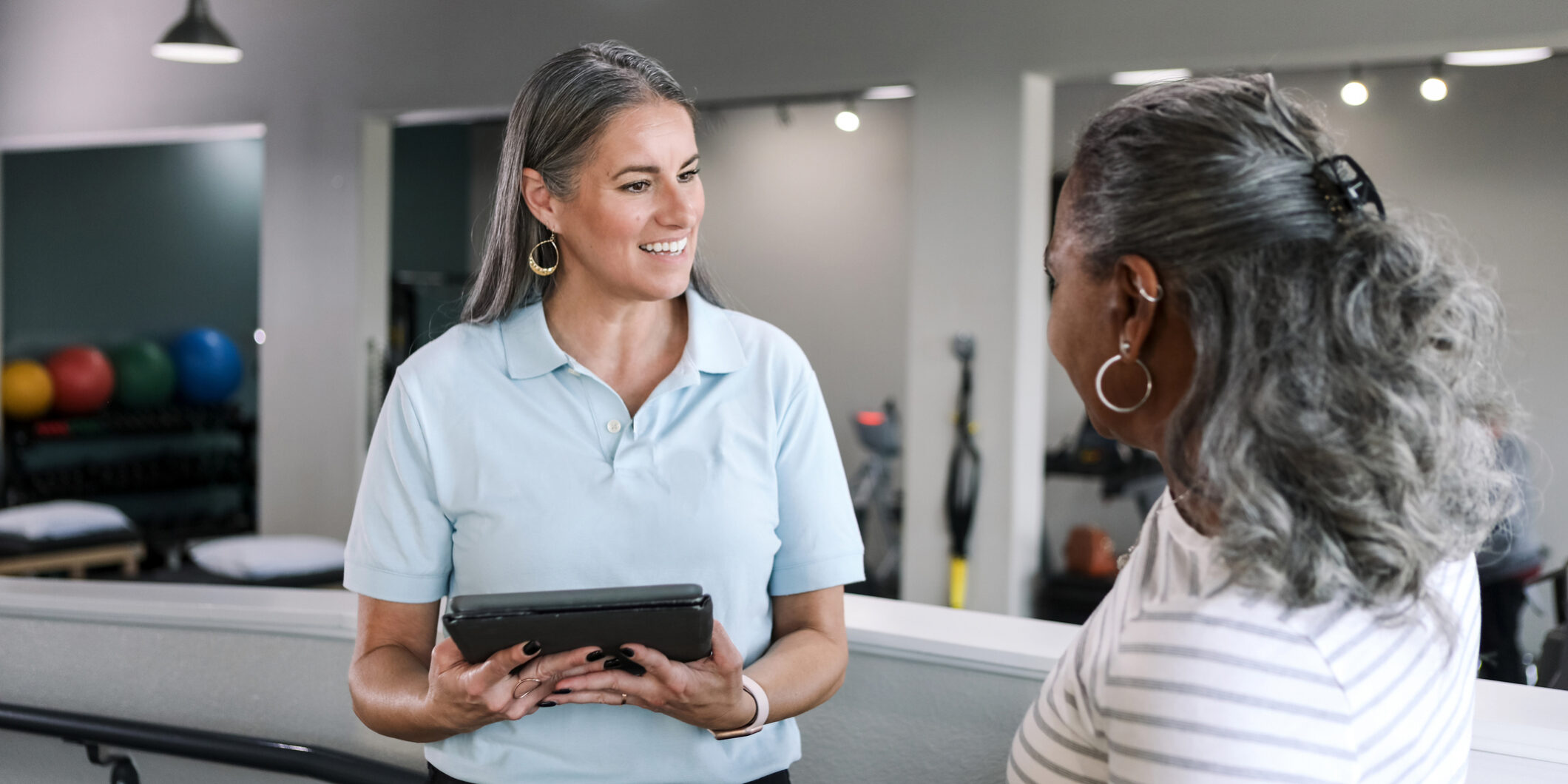 Therapist and Patient Discussing Treatment Plan AI Documentation for Physical Therapists