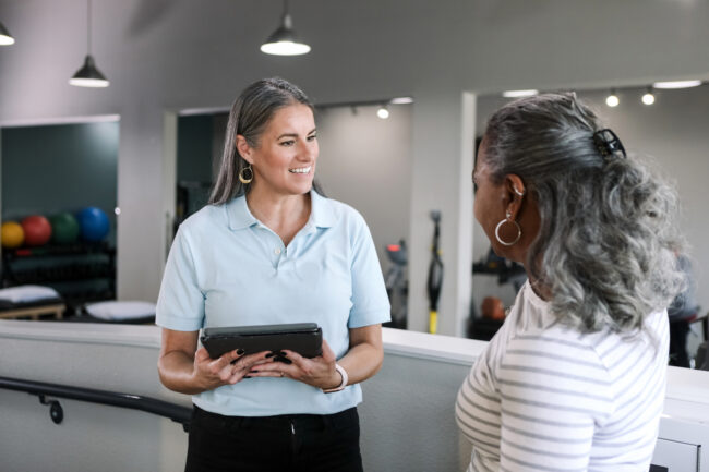 Therapist and Patient Discussing Treatment Plan AI Documentation for Physical Therapists